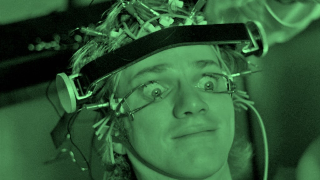 Alex DeLarge undergoes aversion therapy in A Clockwork Orange, his eyes forcibly held open while he watches violent imagery—a metaphor for forced perspective and the illusion of objectivity in storytelling.