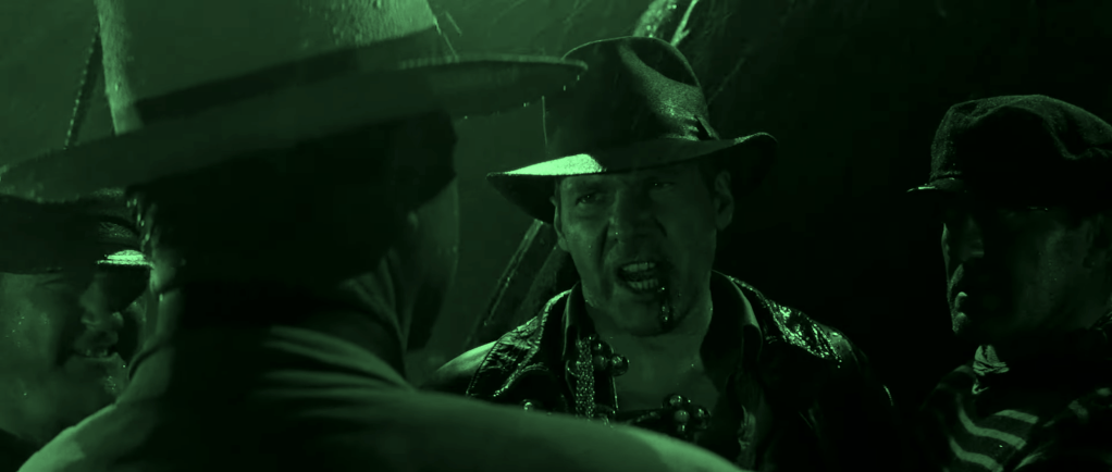 Indiana Jones angrily confronts enemies in The Last Crusade, referencing the iconic line 'It belongs in a museum!' to highlight cultural ownership.